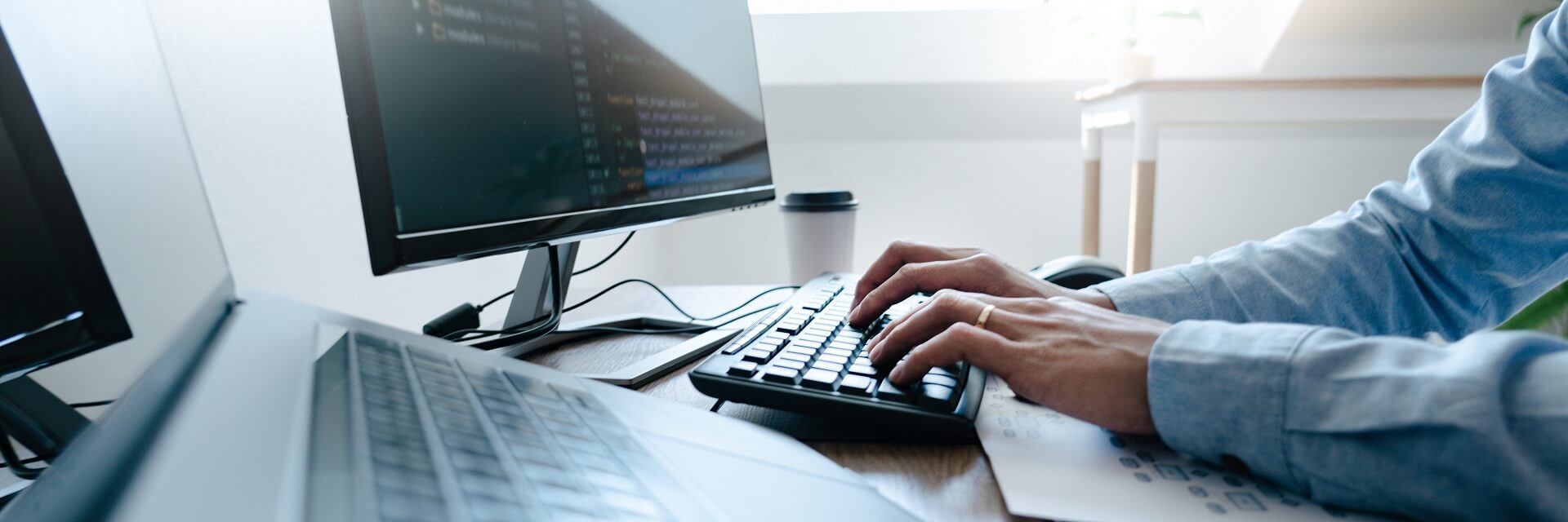 programmer-working-on-computer-in-it-office-typing-data-coding-in-software-and-checking-code-on-computer-screen